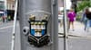 Dublin coat of arms with the city motto on a lamppost on Dame Street.