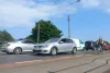 Cars on the road in an urban area.