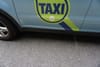 Some Taxi Drivers’ Bumper Stickers Target Immigrants