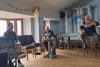 In Skerries, a circle gathers to share songs, one after another