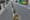 Why has some of the greenery in city planters been left to wither?