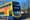 A yellow Dublin Bus fills most of the image, its neon lettering on the front says: "We are hiring!"