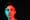 A headshot of Chósta in red and green light, against a black background.